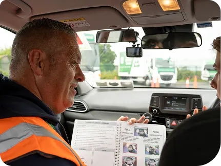 Young_lady_sitting_in_Driving_seat_with_instructor_ISM_Driving_Lessons