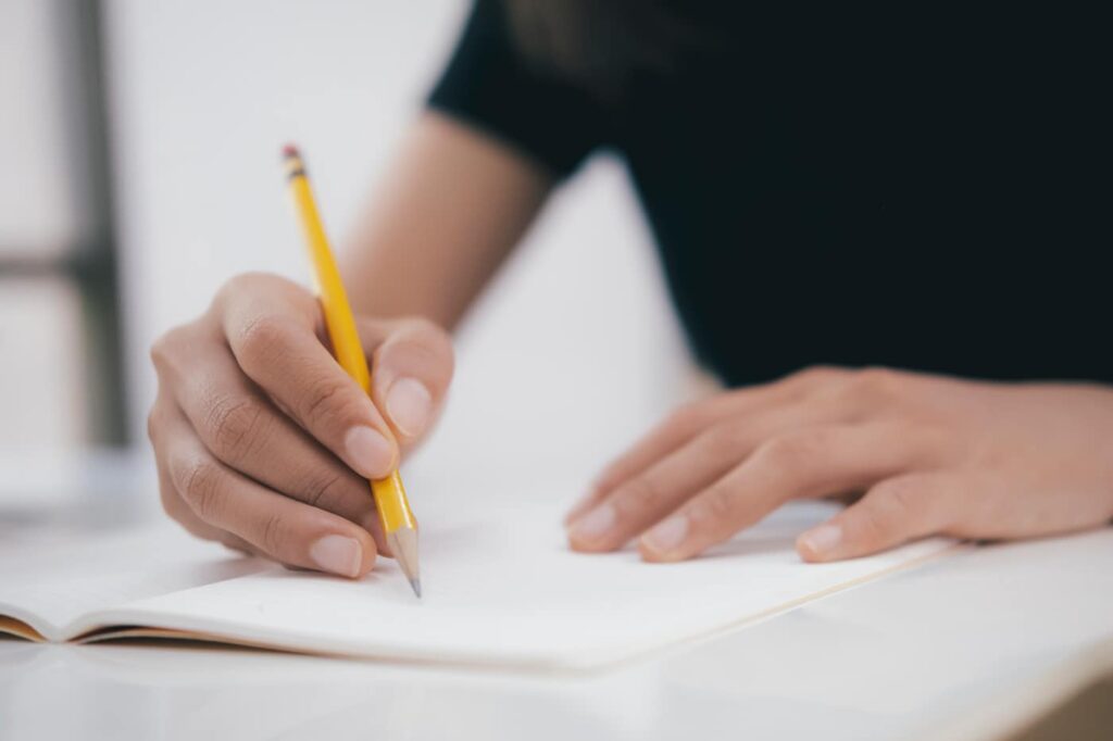 Man_using_pencil_for_driving_test_ISM_Training_and_Recruitment