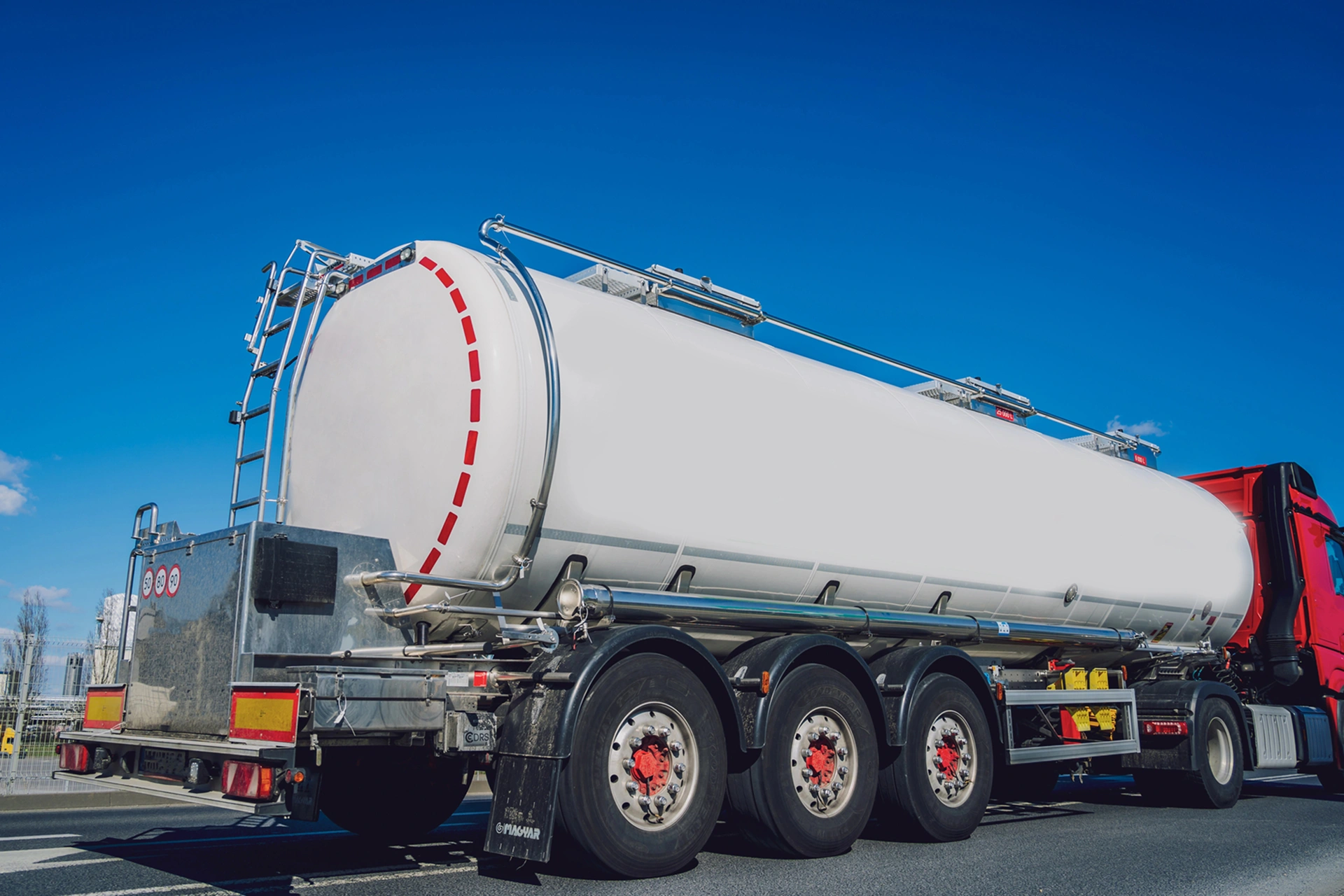 A_large_tanker_truck_driving_along_a_highway _ISM_Training_and_Recruitment
