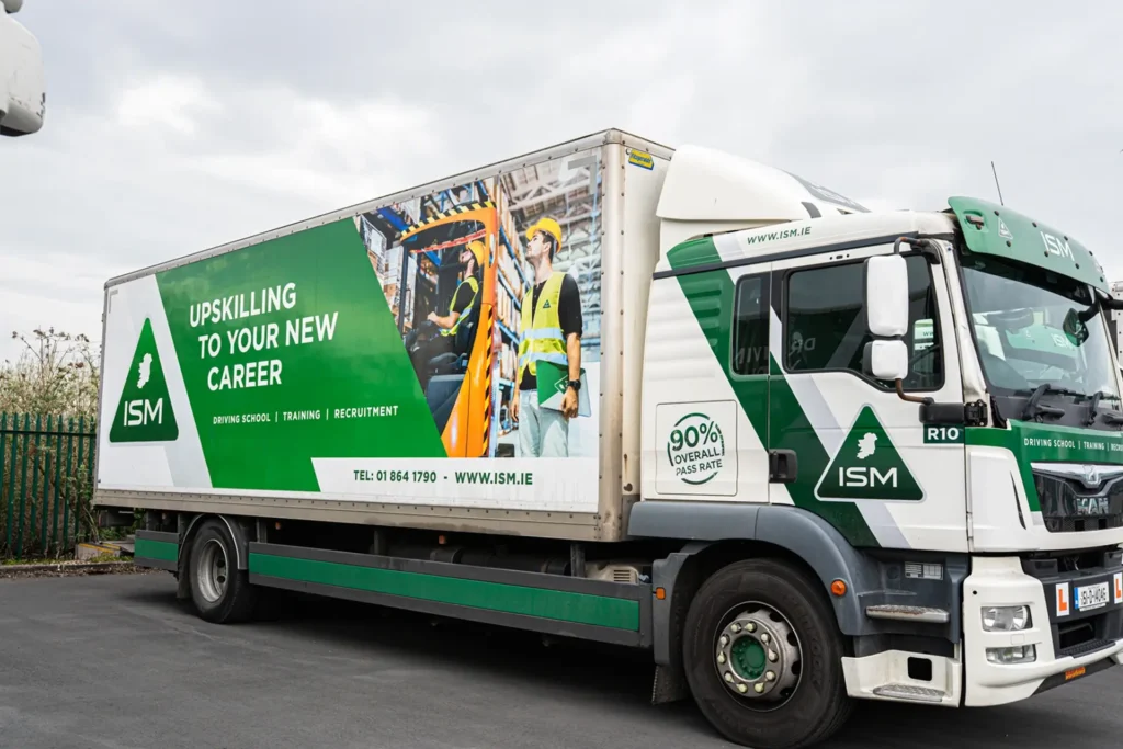 A_large_truck_featuring_a_ISM_logo_on_its_side_ISM_Driving_lessons