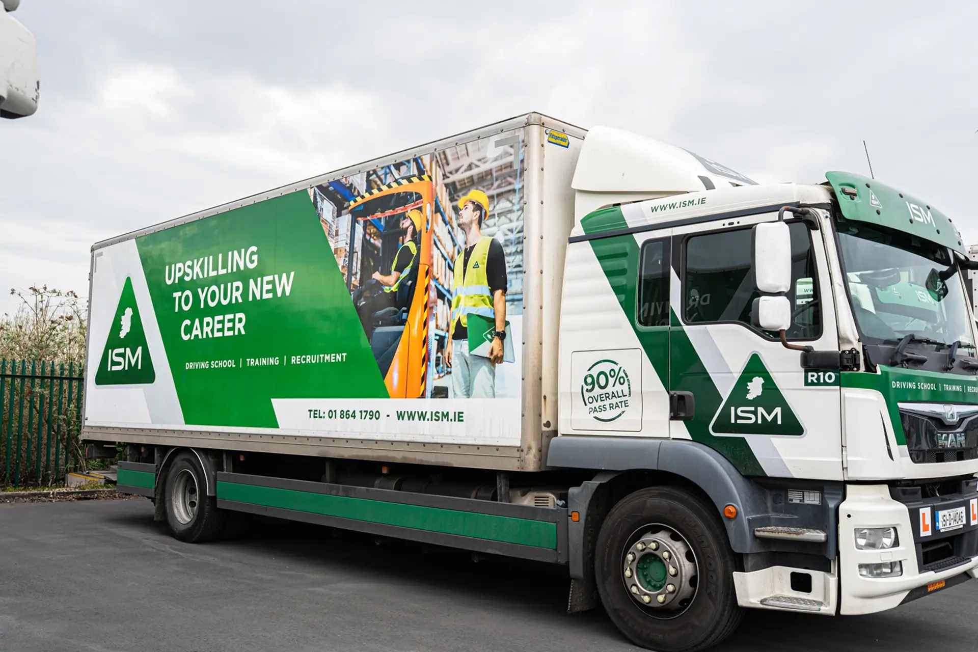 A_large_truck_featuring_a_ISM_logo_on_its_side_ISM_Driving_lessons