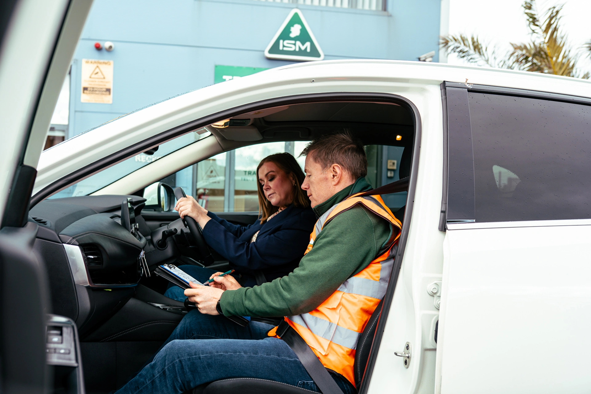 Young_woman_with_driving_instructor_sitting_in_a_car _ISM_Training_and_Recruitment