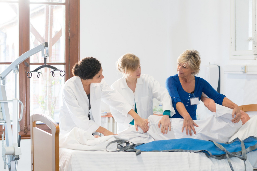 Medical_staff_in_white_coats_are_attending_to_a_patient _ISM Training_and_Recruitment